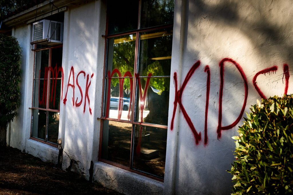 Unmask my kids!. political, anti mask, political violence, vandalism, school, education, parents, pandemic, Covid, reportage.