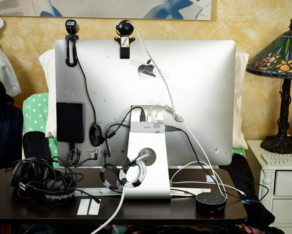 Henry's Computer. Stretch RE1, caregiver, disability, reportage, technology, Hello Robot, Robots for Humanity, Henry Evans, research, robot, robotics, computer, head tracking device, computer cords, computer wiring.
