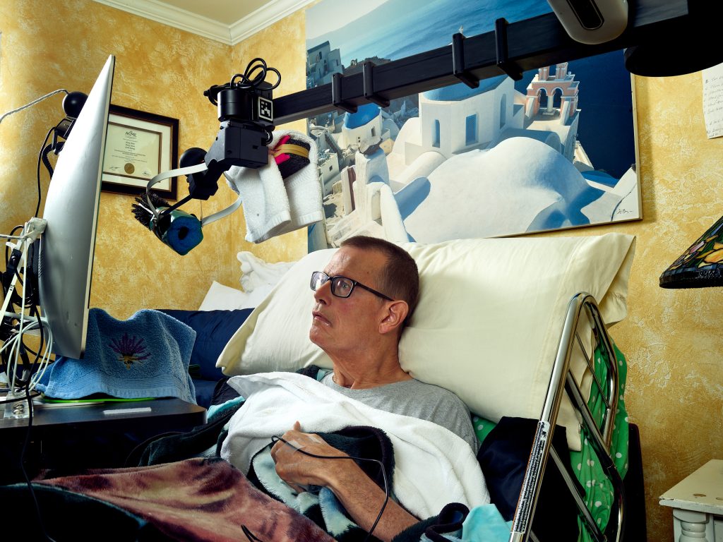 Henry Evans Brushing His Hair. Stretch RE1, caregiver, disability, reportage, technology, Hello Robot, Robots for Humanity, research, robot, robotics, Henry Evans.