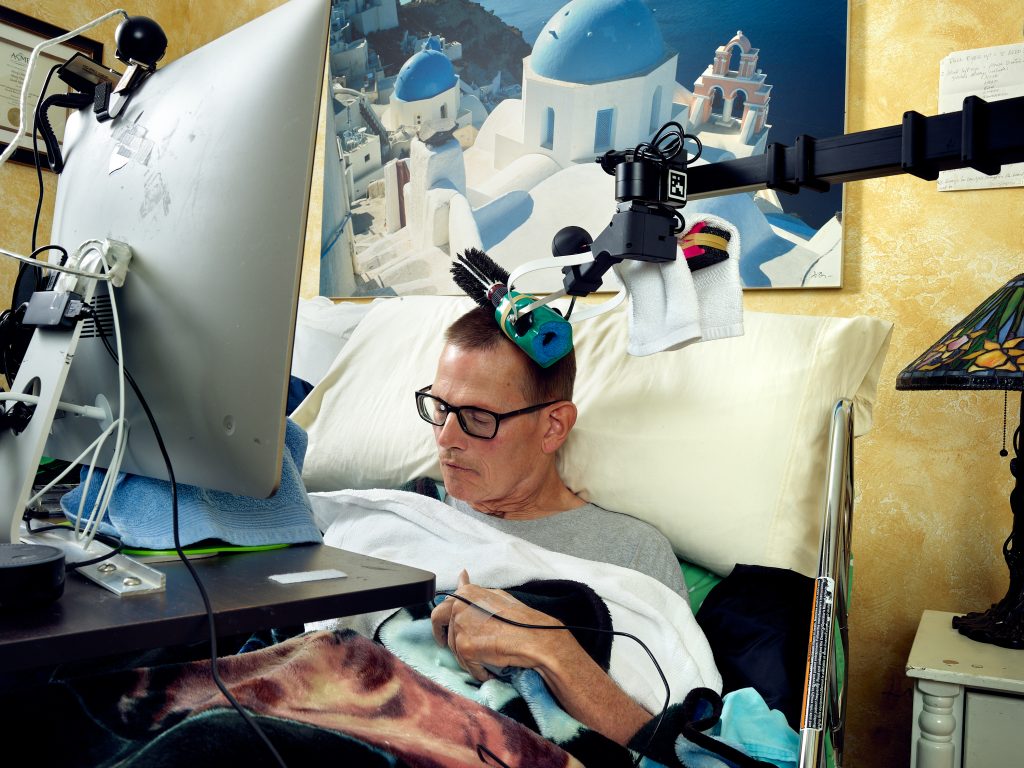 Henry Evans Brushing His Hair. Stretch RE1, caregiver, disability, reportage, technology, Hello Robot, Robots for Humanity, Henry Evans, research, robot, robotics.