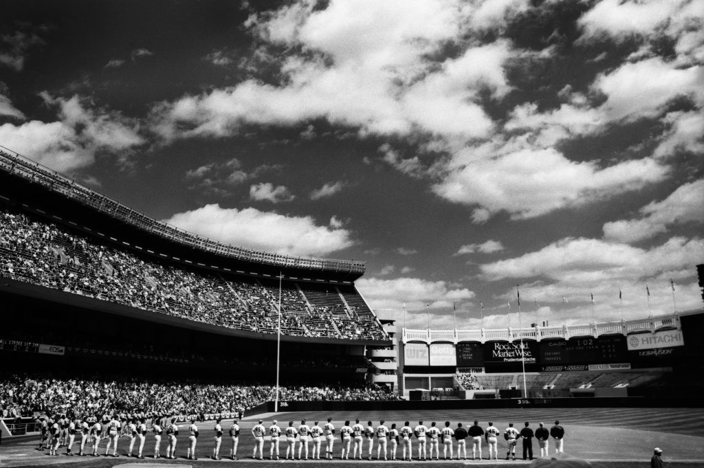 Opening Day at Yankee Stadium. baseball, stadium, urban, nyc, national anthem, team, spectator sport, sky, clouds.