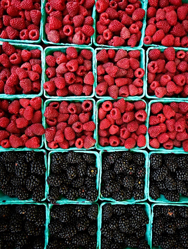 Raspberry Blackberry Containers. farmers market, fruits, food, still life, onions, organic, produce, vegitables, yellow onions.