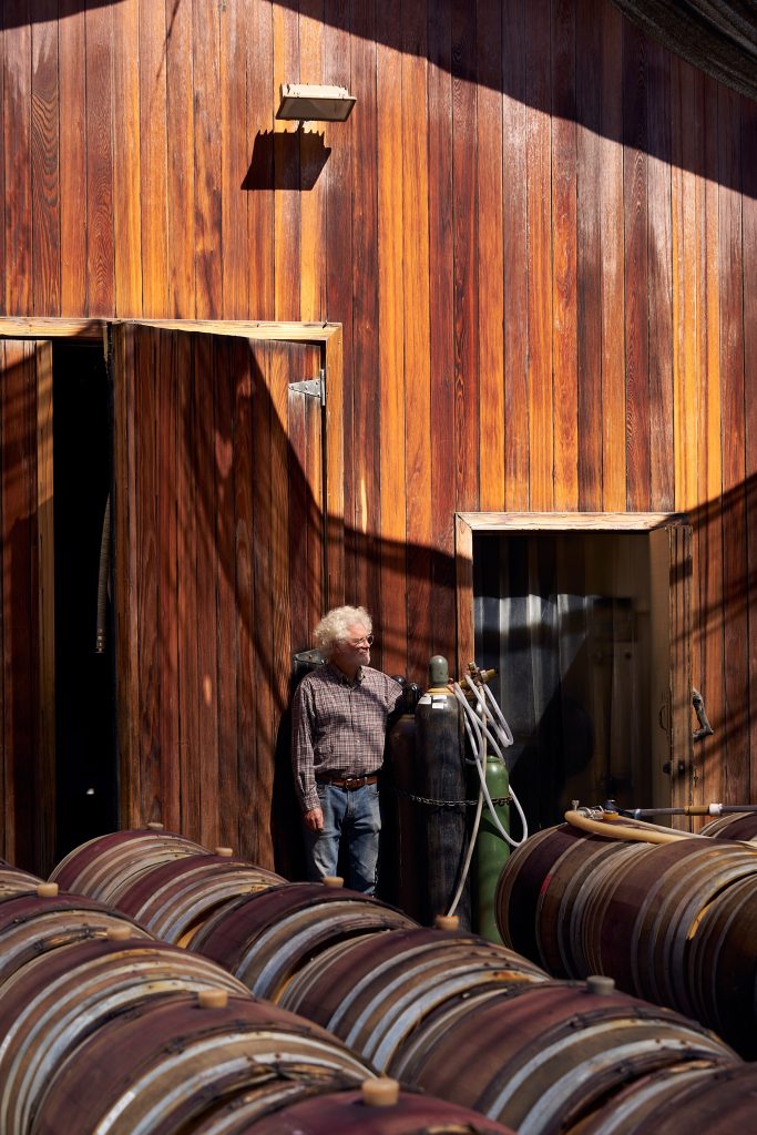 Wine Racking Process. farmer, Ojai Vinyard, Adam Tolmach, racking, vinyard, wine, wine barrels, wine racking, winemaking, portrait, ojai valley agriculture.